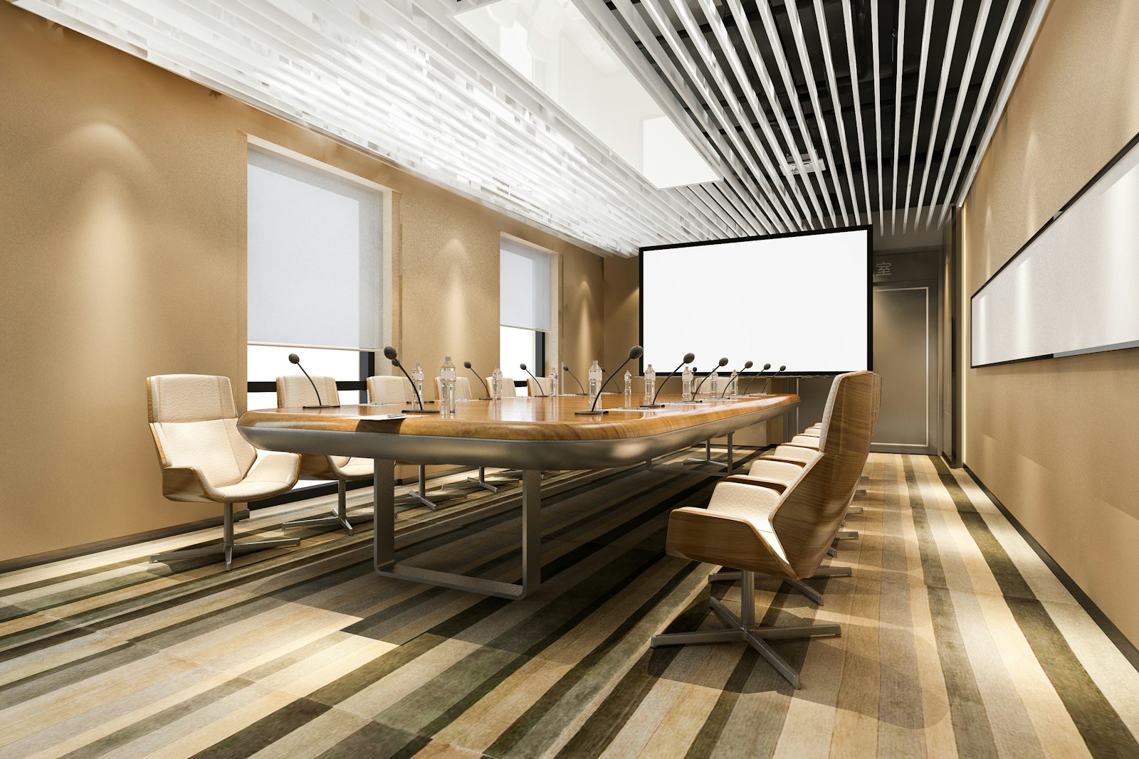 Boardroom with a long table, gooseneck microphones and a projection screen
